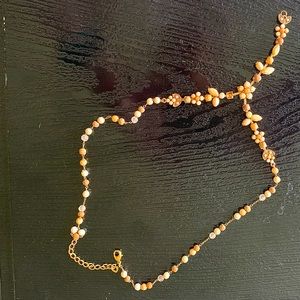 Necklace with natural color beads.